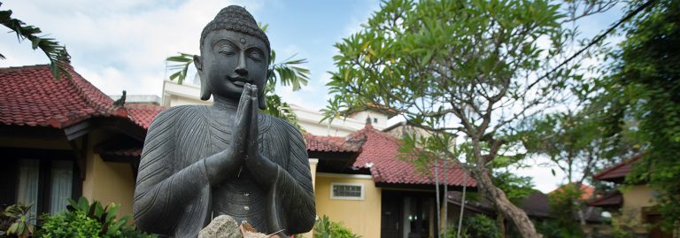 Buddha statue in Sanur garden, Bali Indonesia