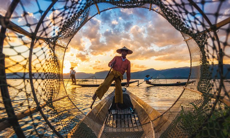 Inle Lake Intha fishermen at sunset in Myanmar
